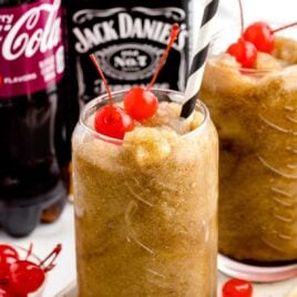 a close-up shot of Jack and Cherry Coke Slushiein a tall glass
