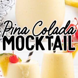 close up of a glass of Pina Colada Mocktail garnished with a slice of pineapple and a cherry