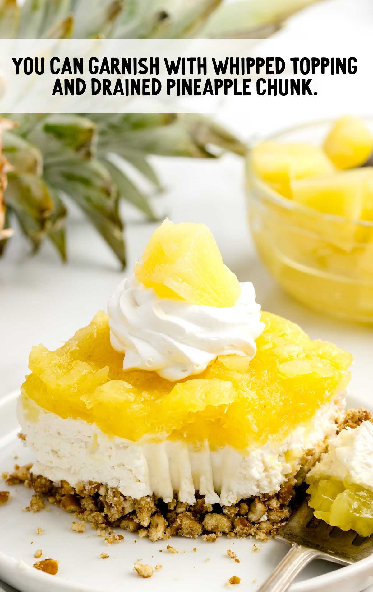 Whipped topping and pineapple chunk garnished