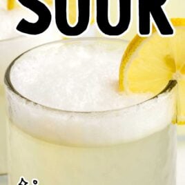 close up shot of a glass of vodka sour garnished with a lemon