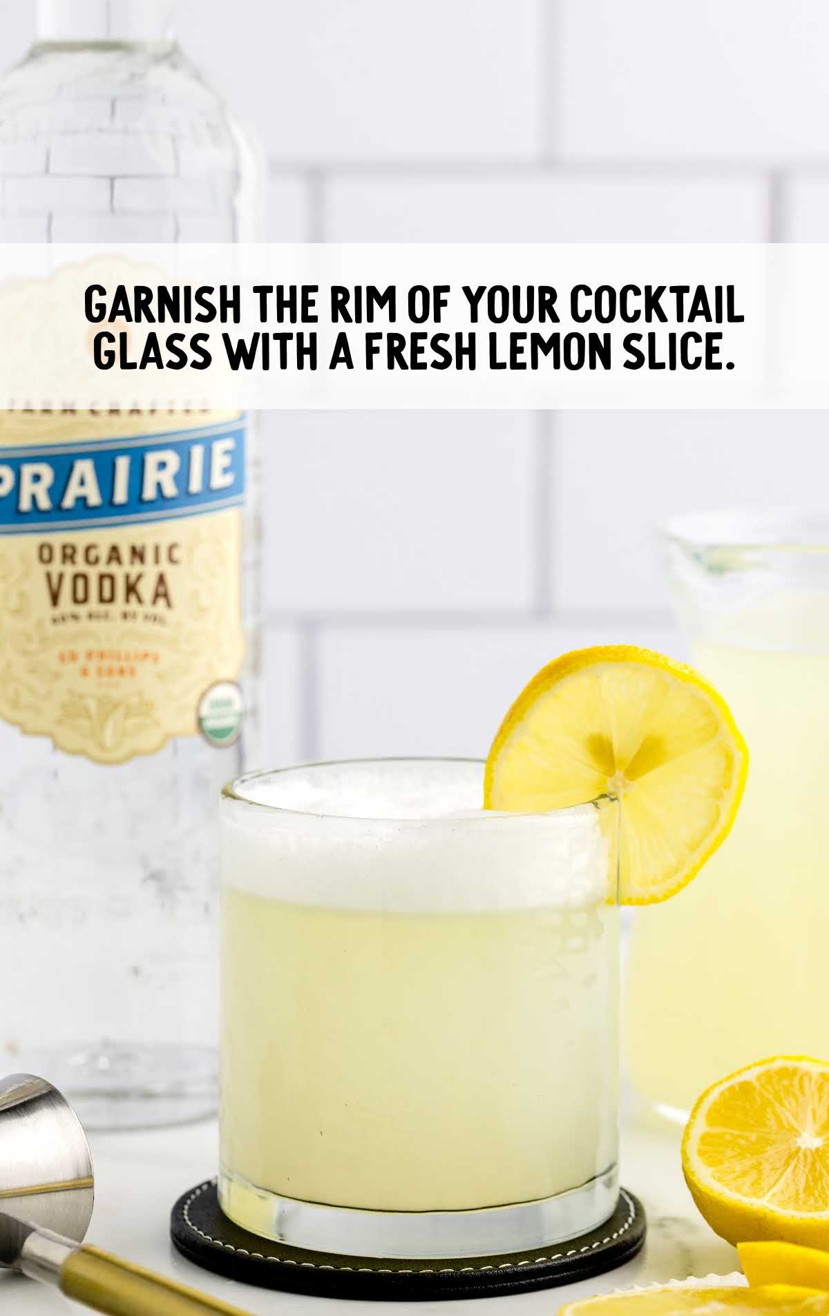 glass of the drink garnished with a slice of lemon