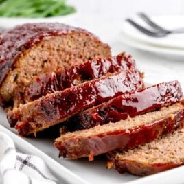 a close up shot of slices of Air Fryer Meatloaf on a plate