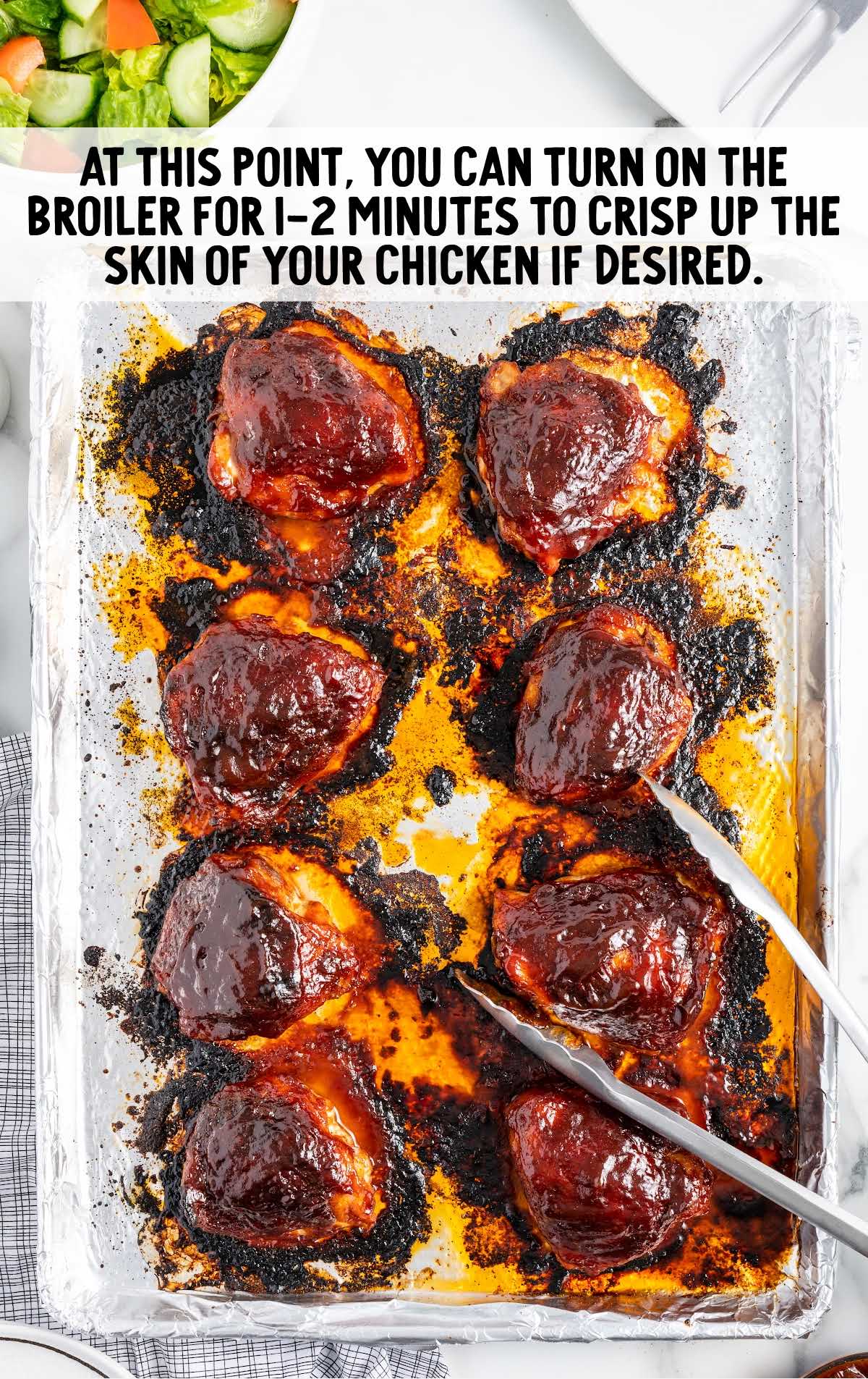bbq chicken thighs baked on a baking dish