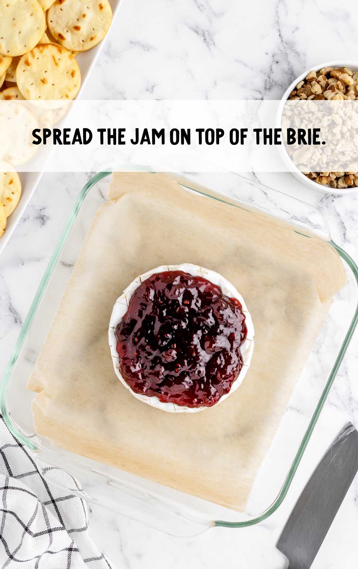 jam spread on top of the baked brie