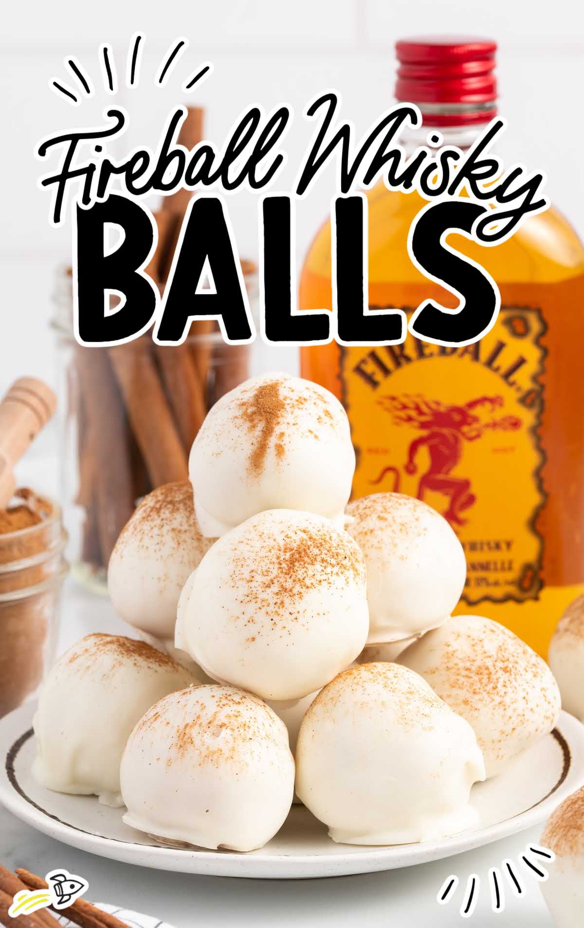 a close up shot of Fireball Whisky Balls piled on top of each other on a plate