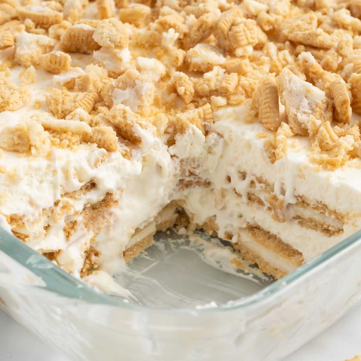 A close up shot of Golden Oreo Dessert in a baking dish with a slice taken out