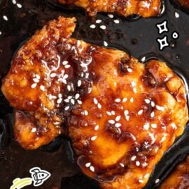 a bunch of honey glazed chicken thighs topped with sesame seeds