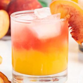 a close up shot of a glass of Peach Schnapps Cocktail