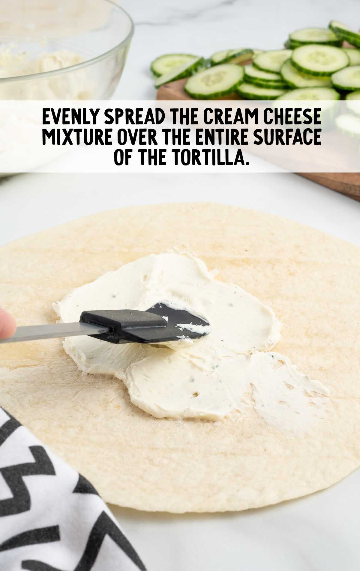 cream cheese mixture spread on top of the tortilla
