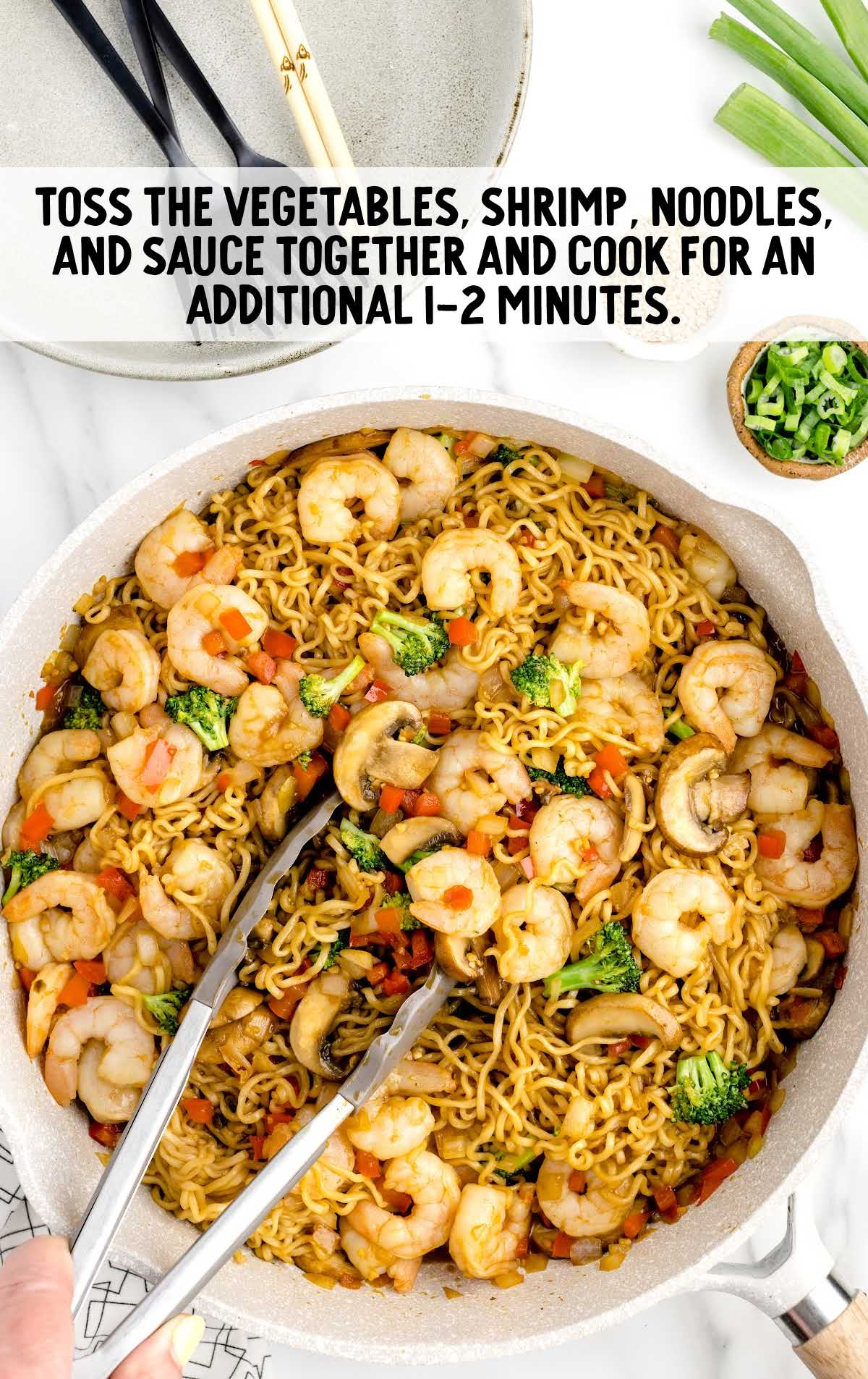 vegetables, shrimp, noodles, and sauce tossed together