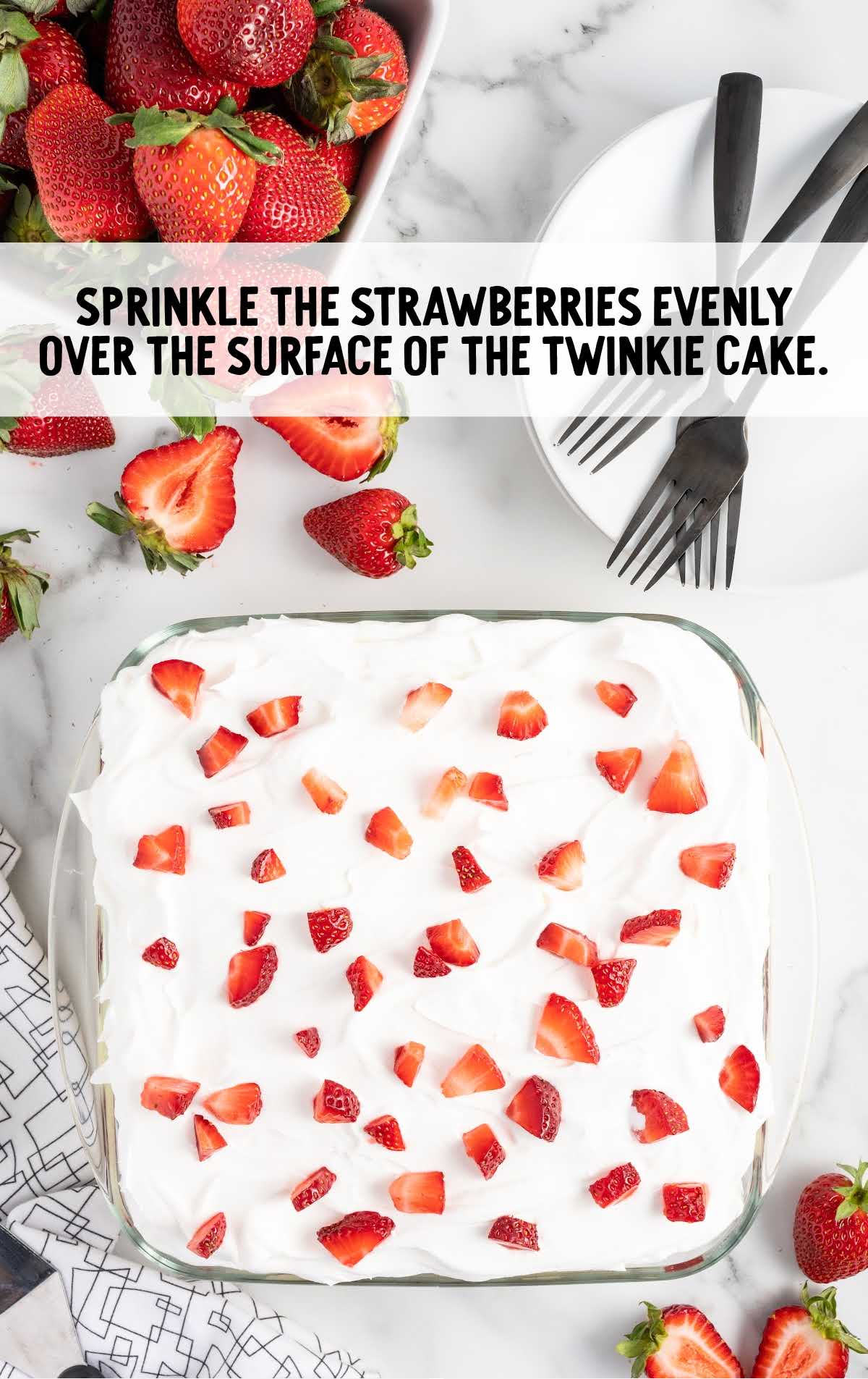 whipped topping topped with sliced strawberries