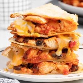 Close up shot of Air Fryer Quesadilla piled on top of each other on a plate