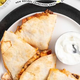 overhead shot of Air Fryer Quesadilla piled on top of each other on a plate