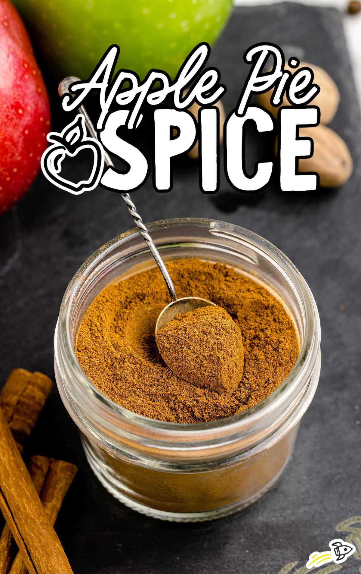 close up shot of a jar of Apple Pie Spice with a spoon