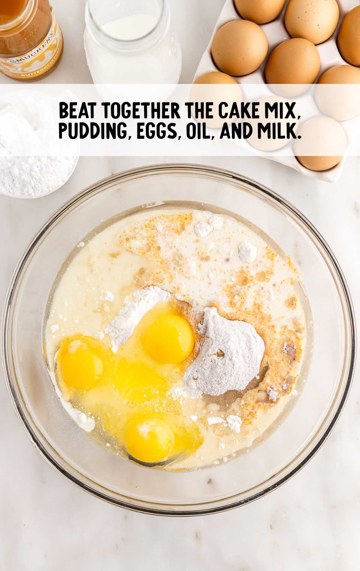 cake mix, instant butterscotch pudding mix, eggs, oil, and milk combined in a bowl