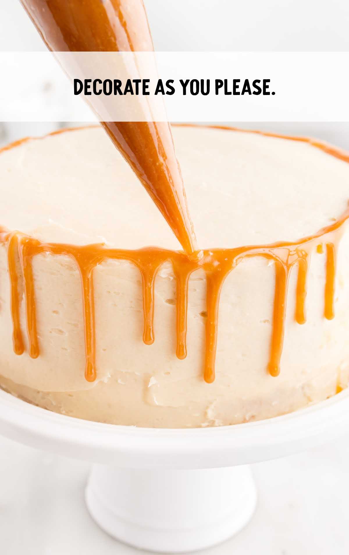 butterscotch sauce drizzled on top of the cake on a cake stand