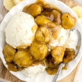 overhead shot of Caramelized Bananas with a scoop of ice cream on a plate