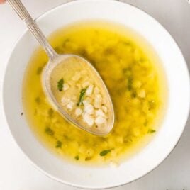 overhead shot of Garlic & Butter Sauce in a bowl with a spoon