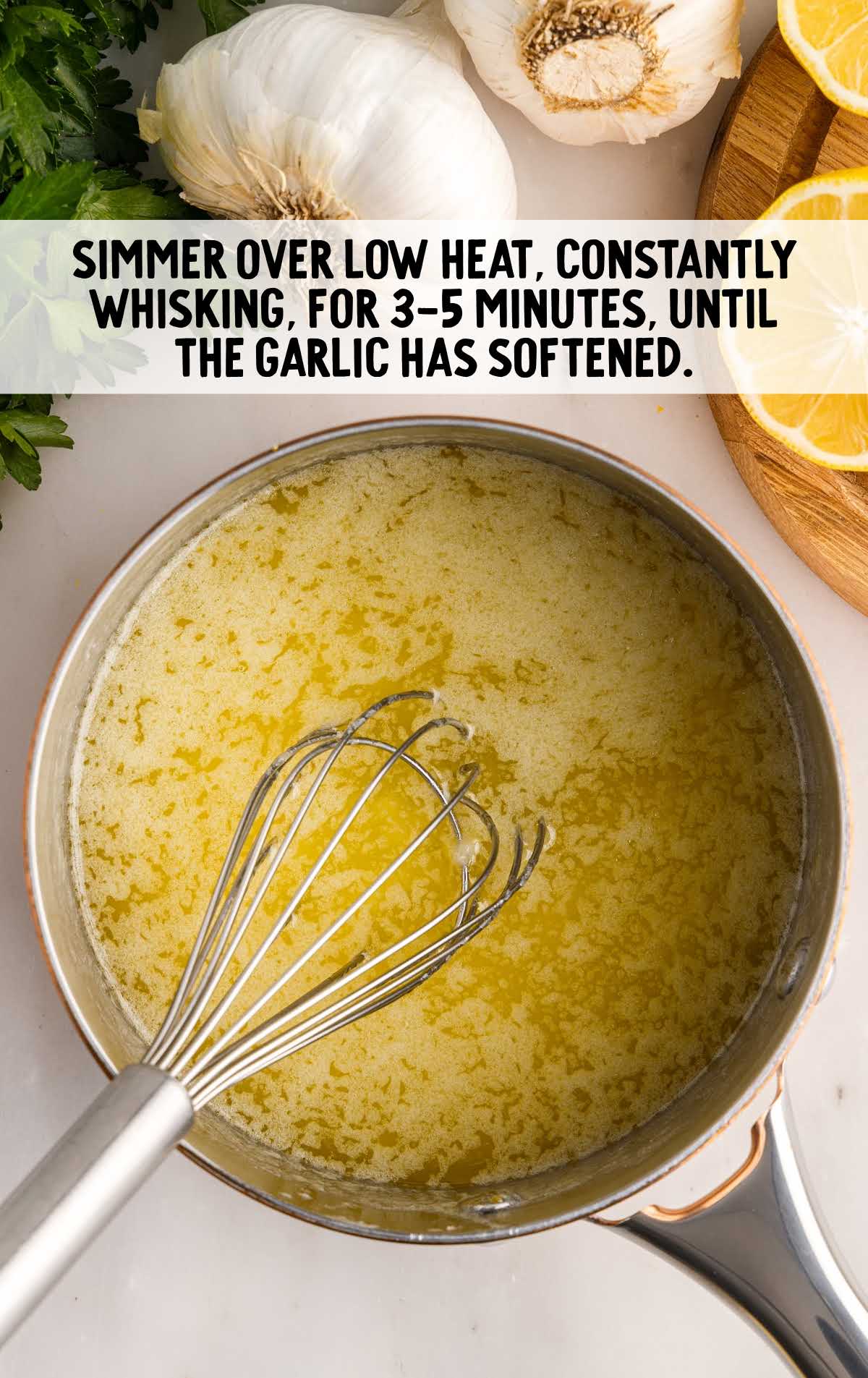 whisked until garlic has softened in a pot