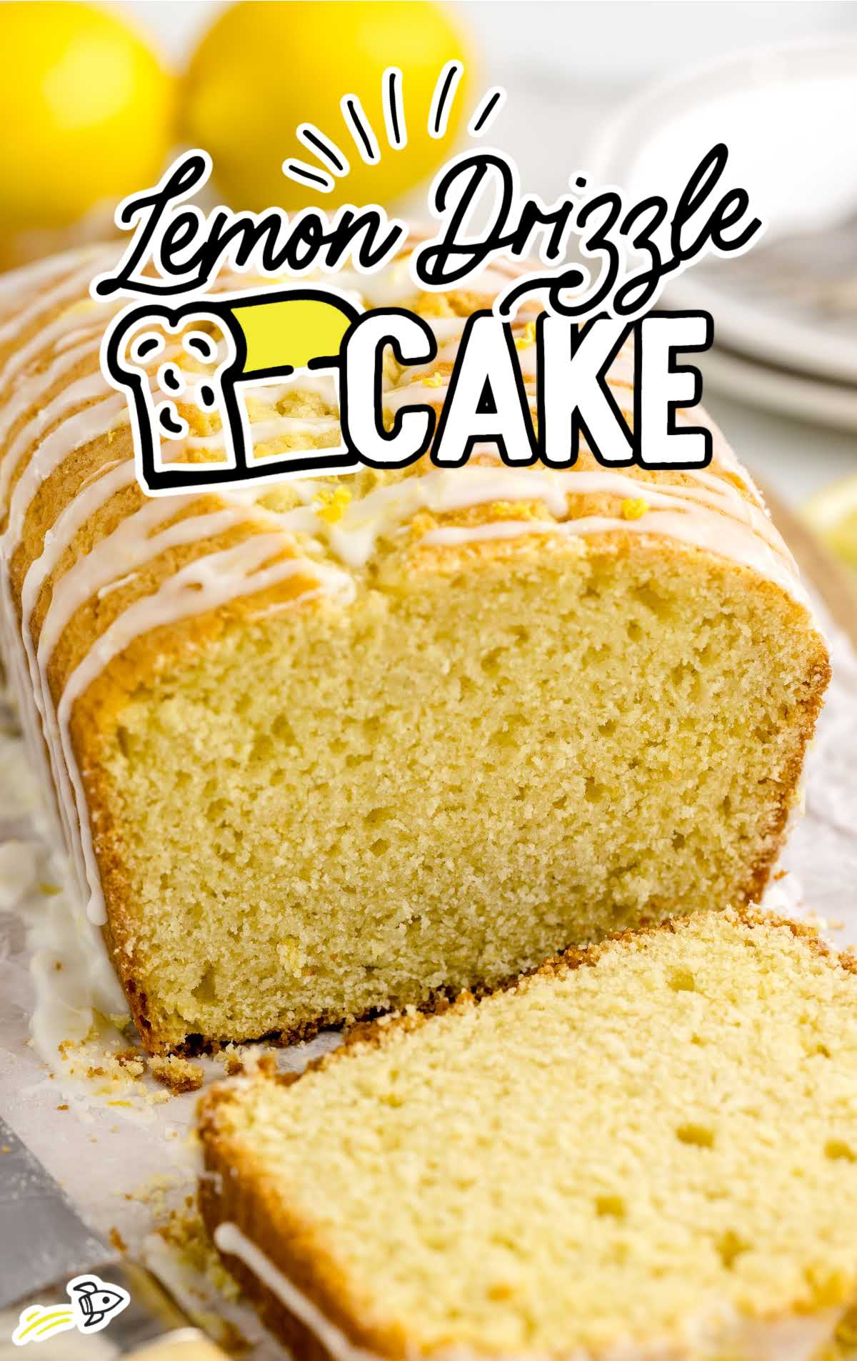 a loaf of lemon cake drizzled with glaze and a slice cut out