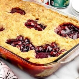 a close up shot of 7UP Cherry Cobbler in a pan