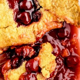 overhead shot of 7UP Cherry Cobbler with a spoon grabbing a piece
