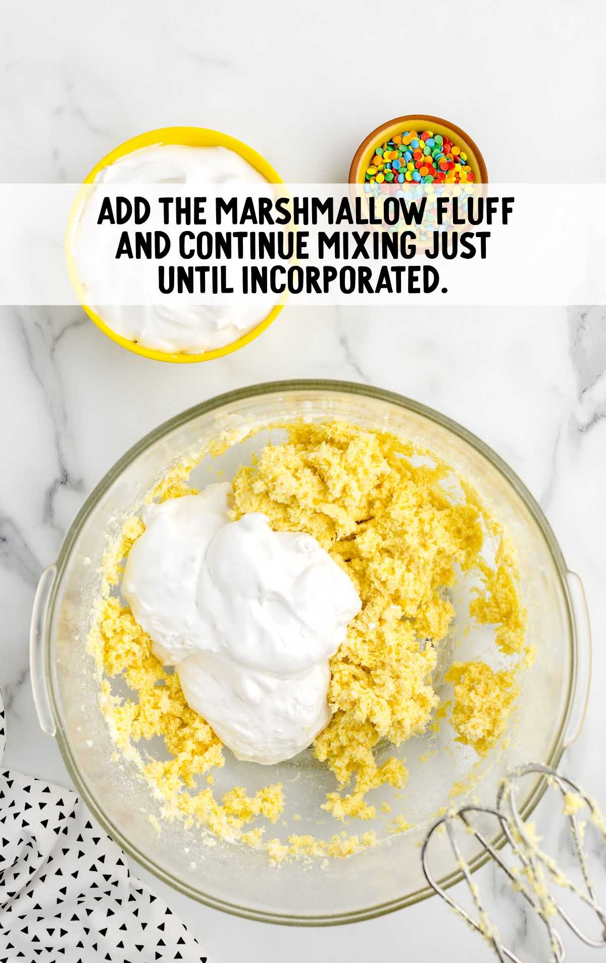 marshmallow fluff folded into the ingredients in the bowl