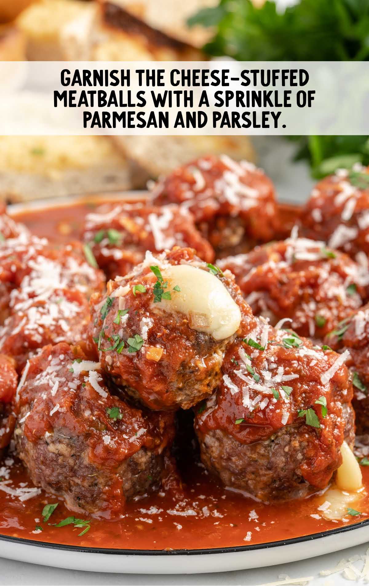 cheese stuffed meatballs garnished with parmesan and parsley