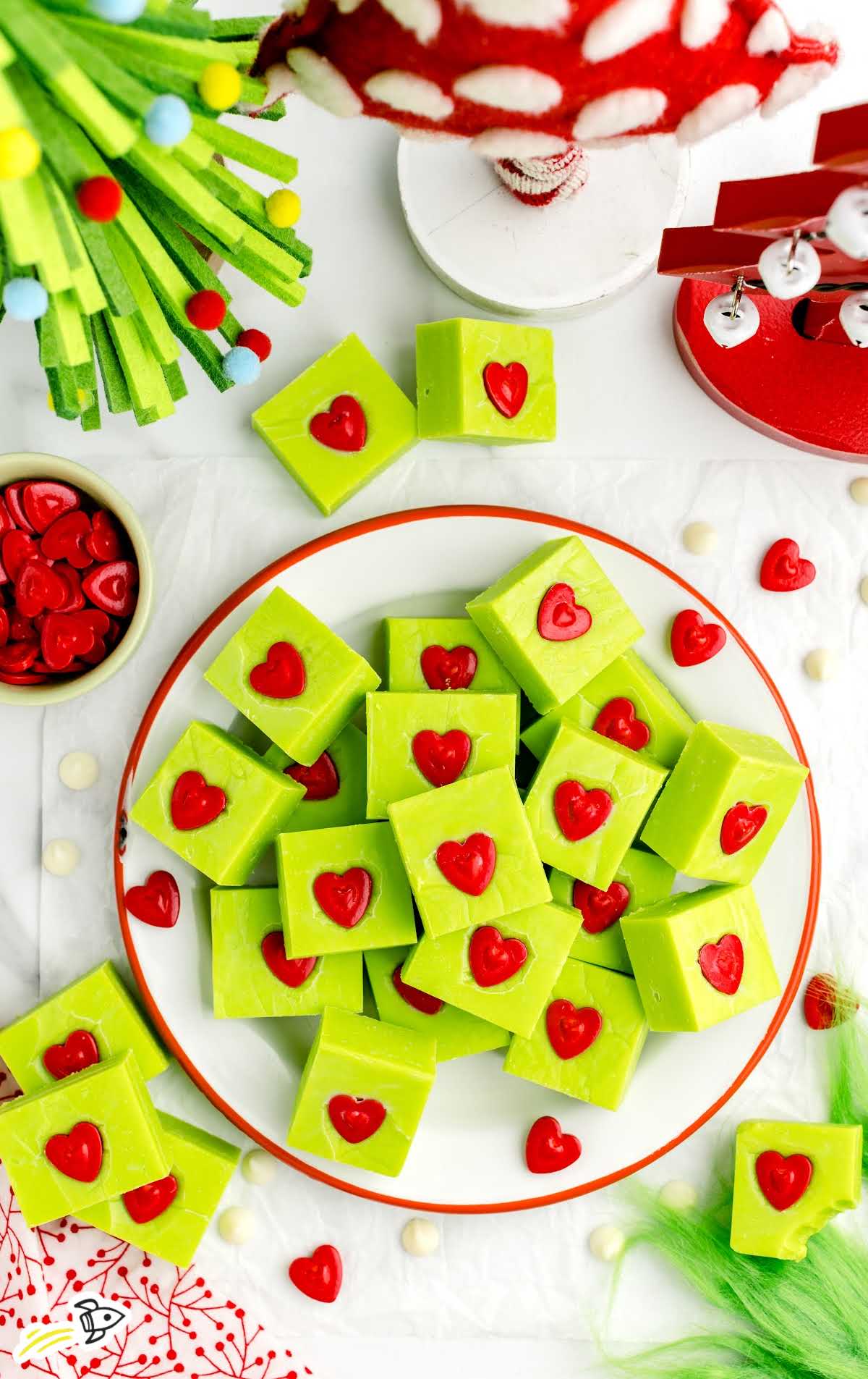 overhead shot of pieces of Grinch Fudge on a plate stacked on top of each other