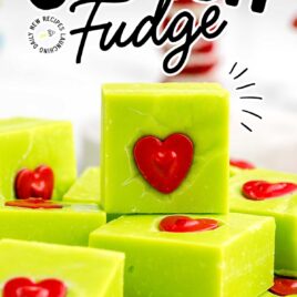 a close up shot of pieces of Grinch Fudge stacked on top of each other on a plate