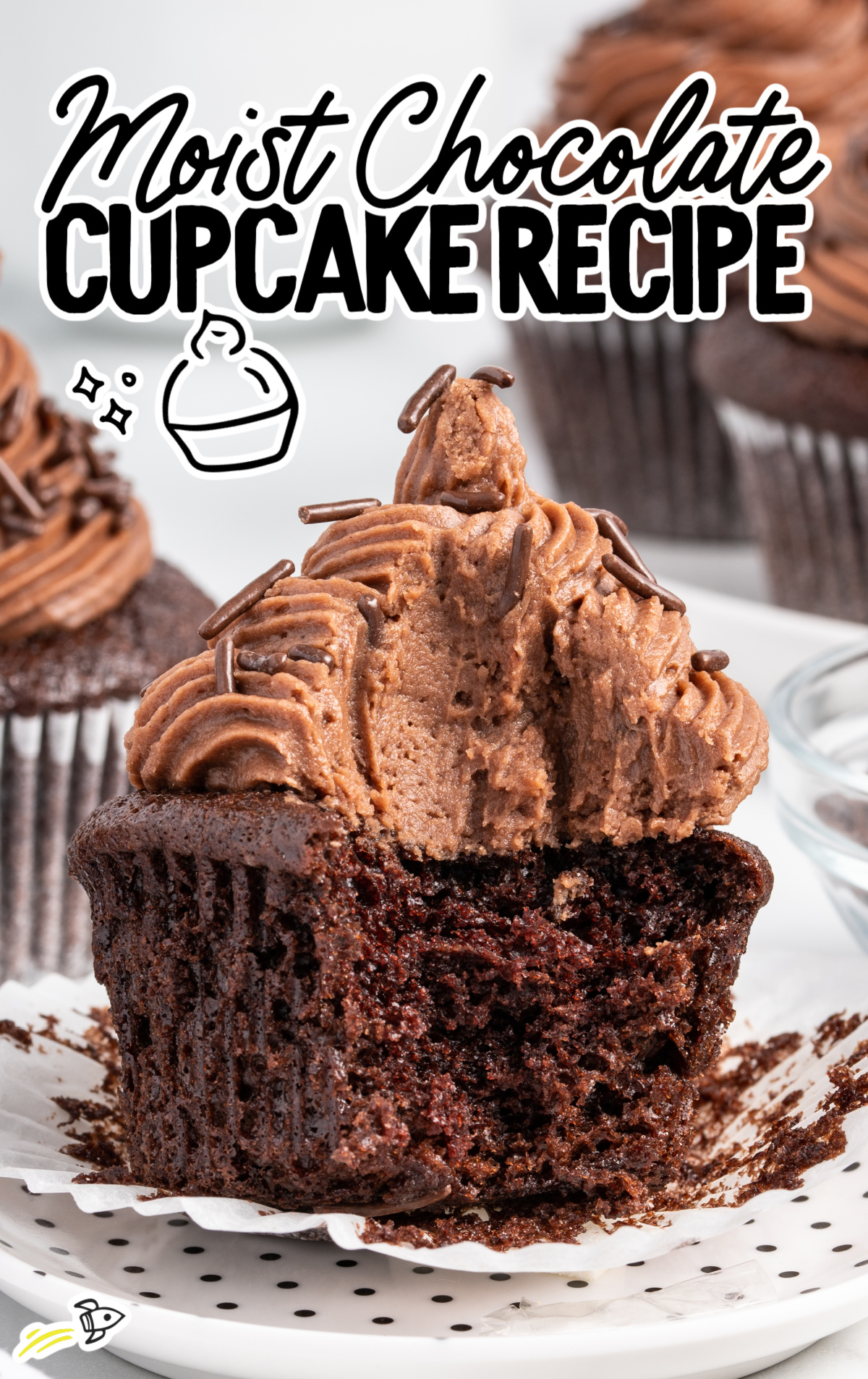 A very Moist Chocolate Cupcake with the wrapper removed and plenty of yummy-looking frosting.