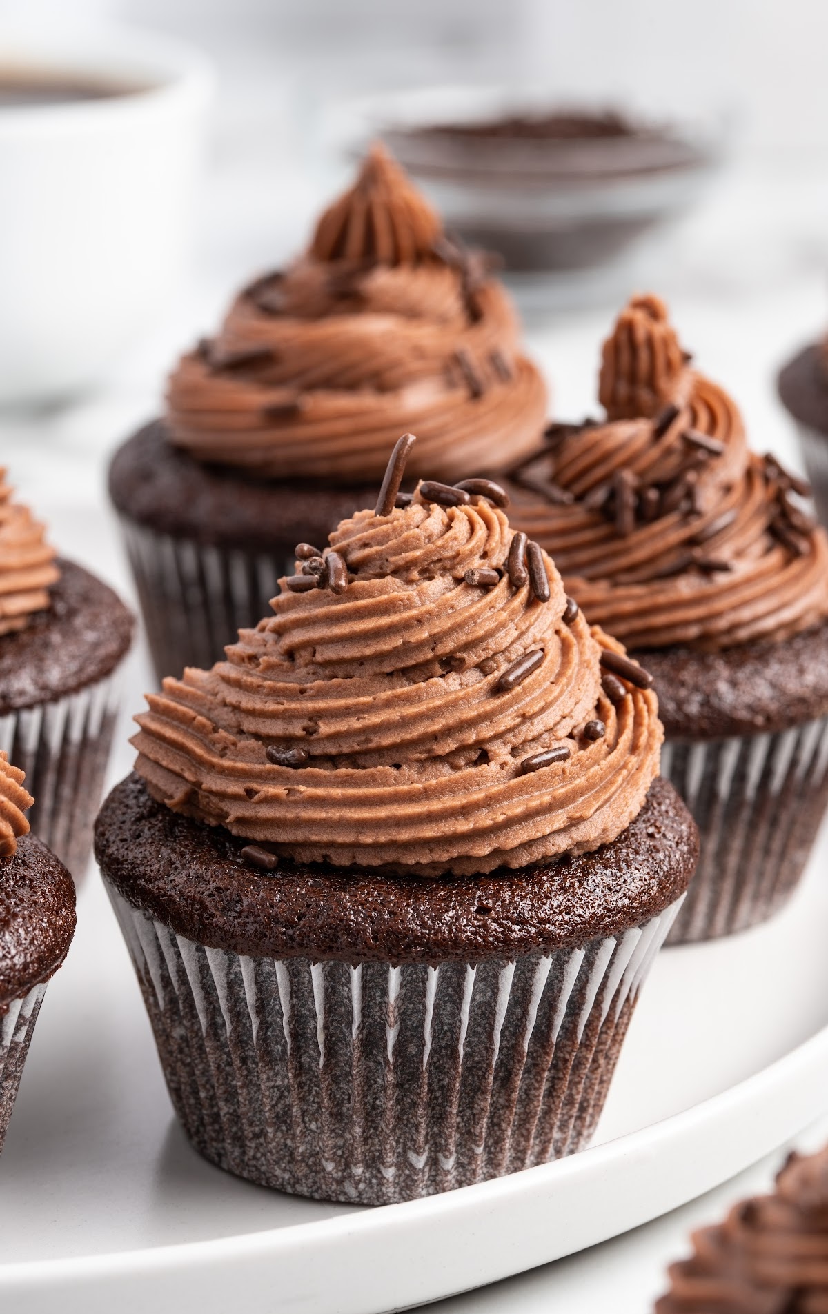 Cupcakes on a white serving plate.