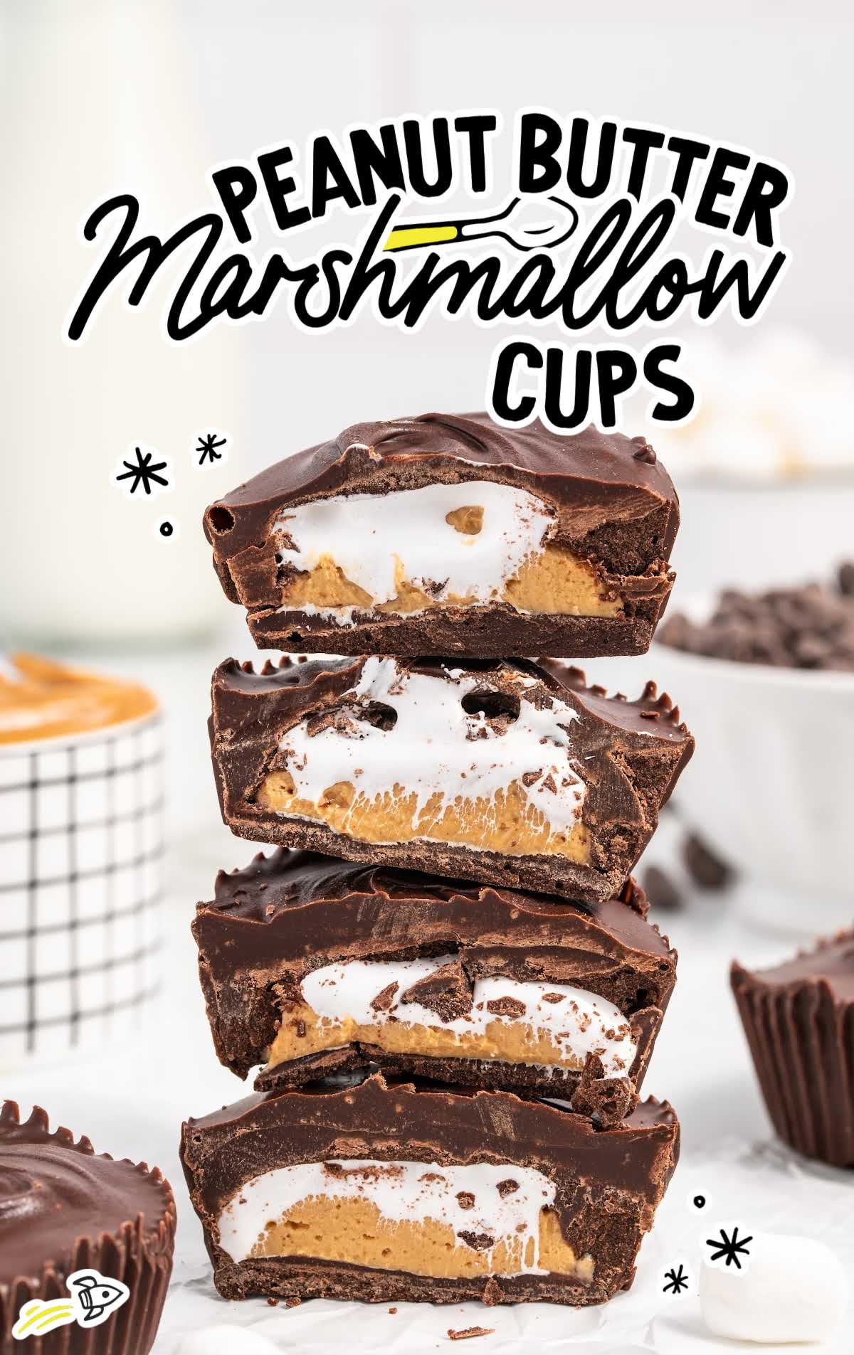 close up shot of Peanut Butter Marshmallow Cups stacked on top of each other with a bite taken out of them