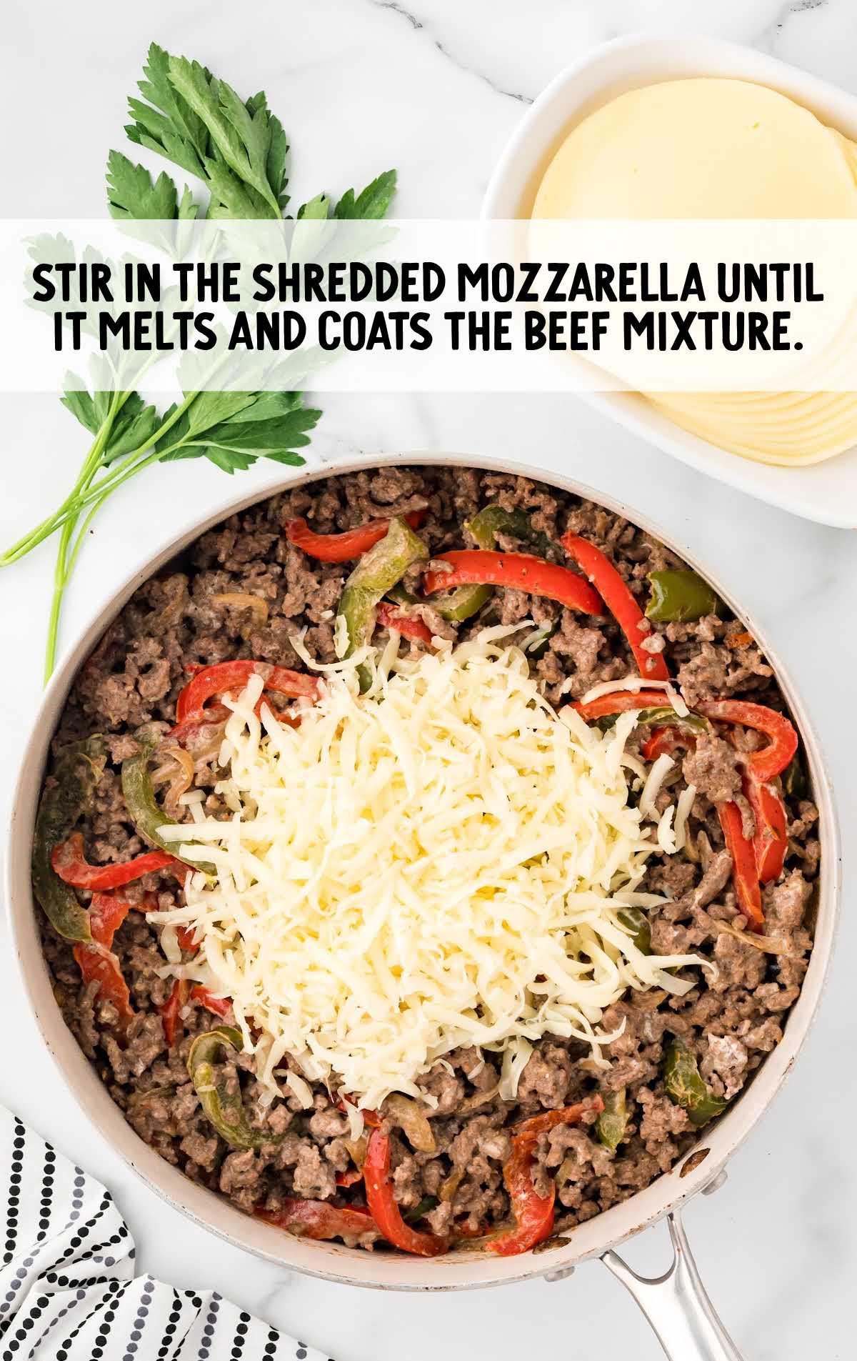 shredded mozzarella added to the skillet