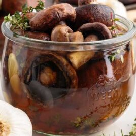 close up shot of Pickled Mushrooms in a glass jar