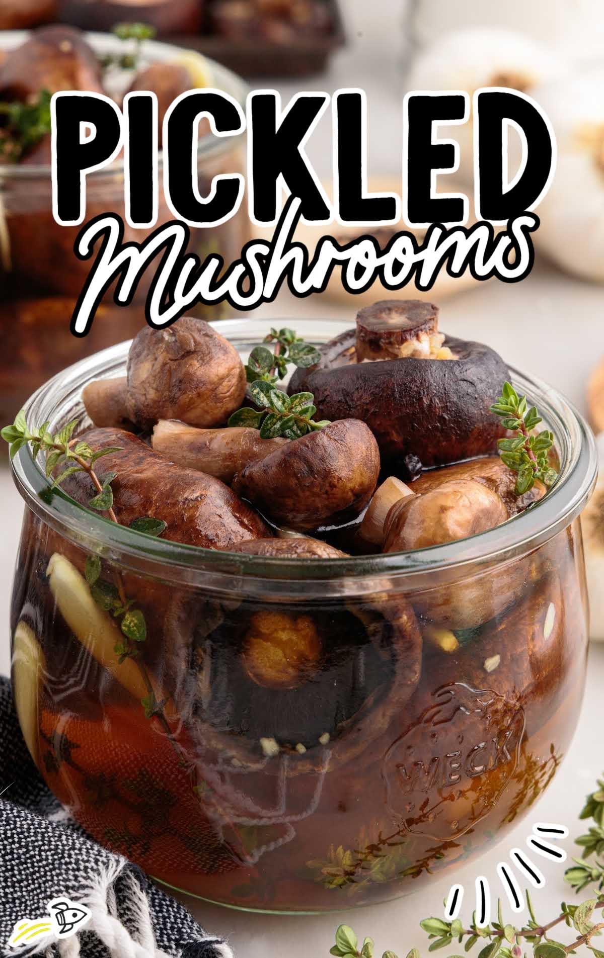 close up shot of Pickled Mushrooms in a glass jar