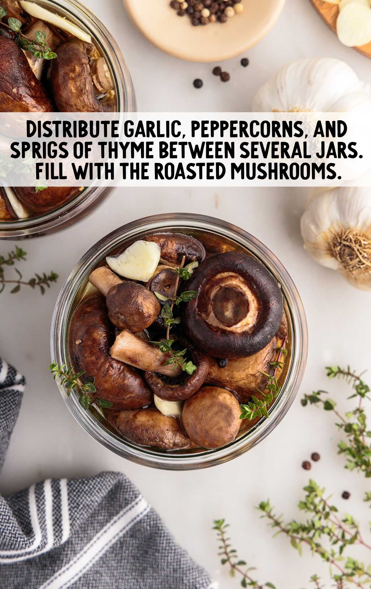 garlic, peppercorns, and springs of thyme distributed between jars