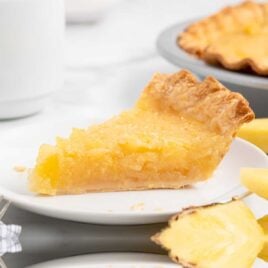 a close up shot of a slice of Pineapple Pie on a plate
