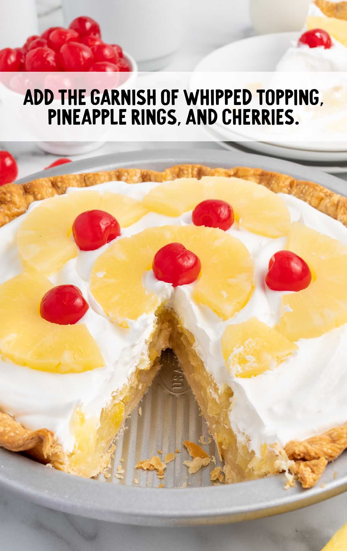 whipped topping, pineapple rings, and cherries garnished