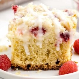 close up shot of a slice of Raspberry Coffee Cake on a plate