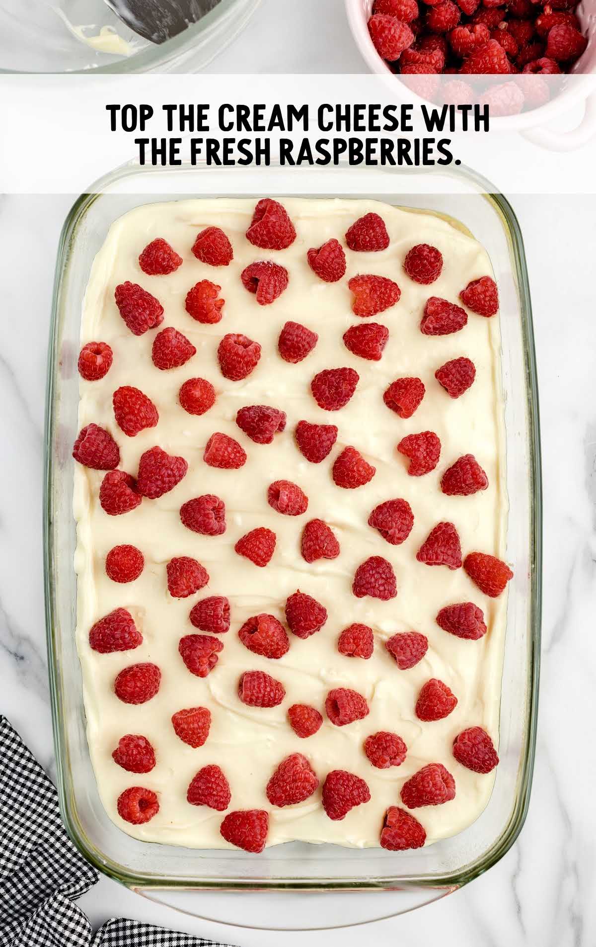 cream cheese topped with raspberries