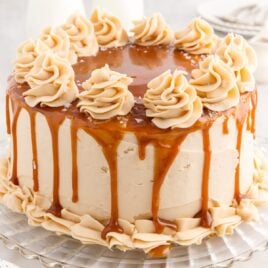 close up shot of a Salted Caramel Cake on a cake stand