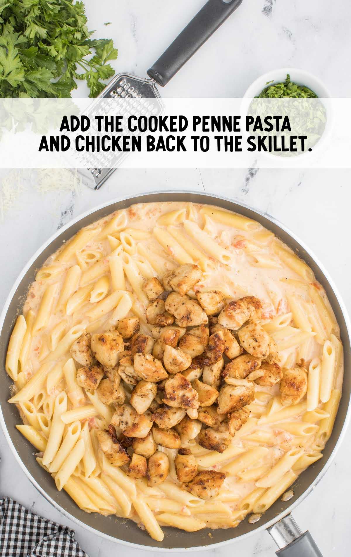 cooked penne pasta and chicken added to the skillet