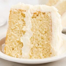 close up shot of a slice of Vanilla Cake on a plate