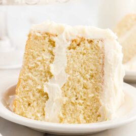 close up shot of a slice of Vanilla Cake on a plate