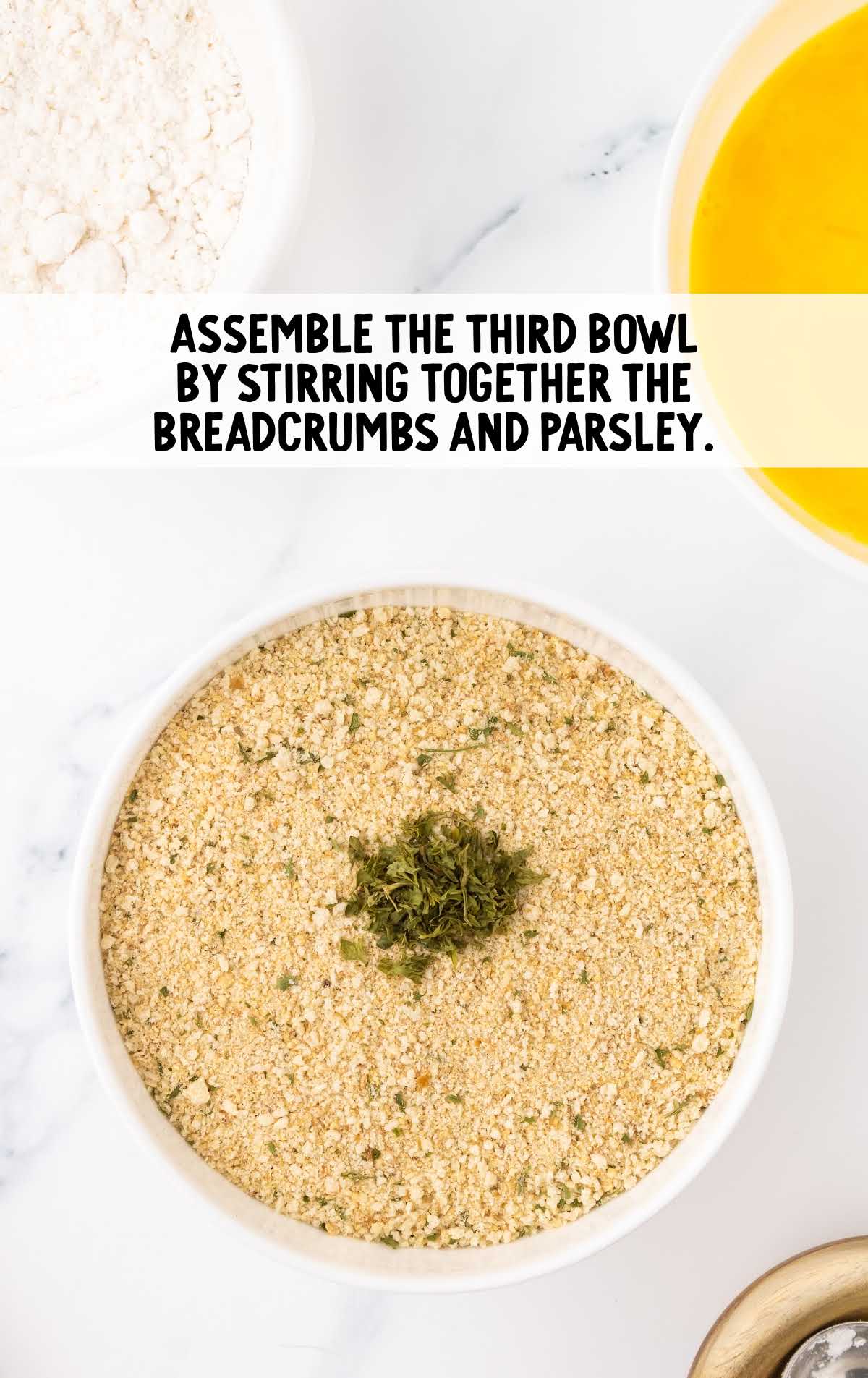 breadcrumbs and parsley combined in the third bowl