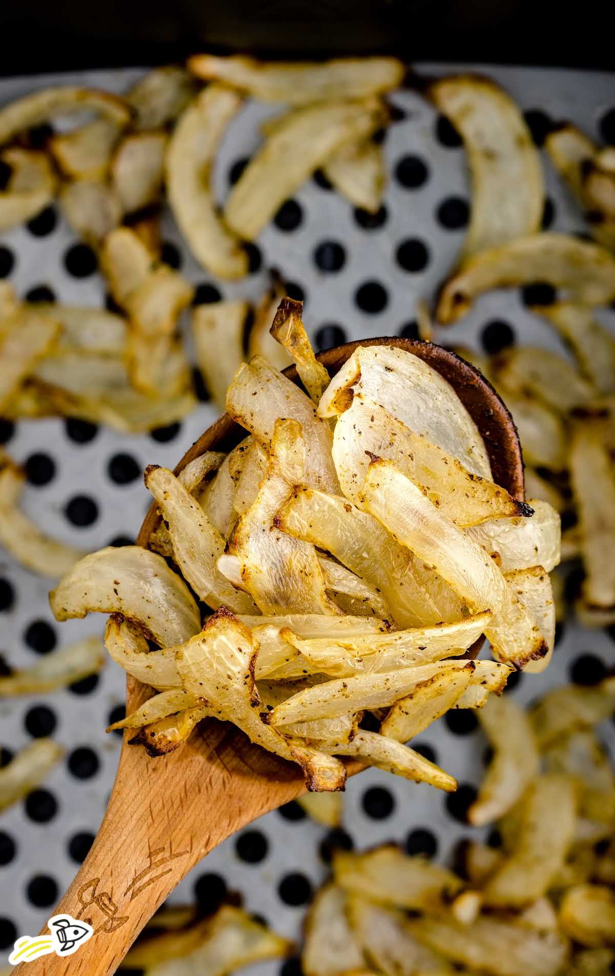 overhead shot of spoon full of Air Fryer Onions
