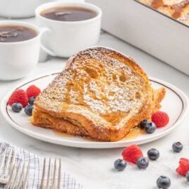 a close up shot of Baked French Toast on a plate