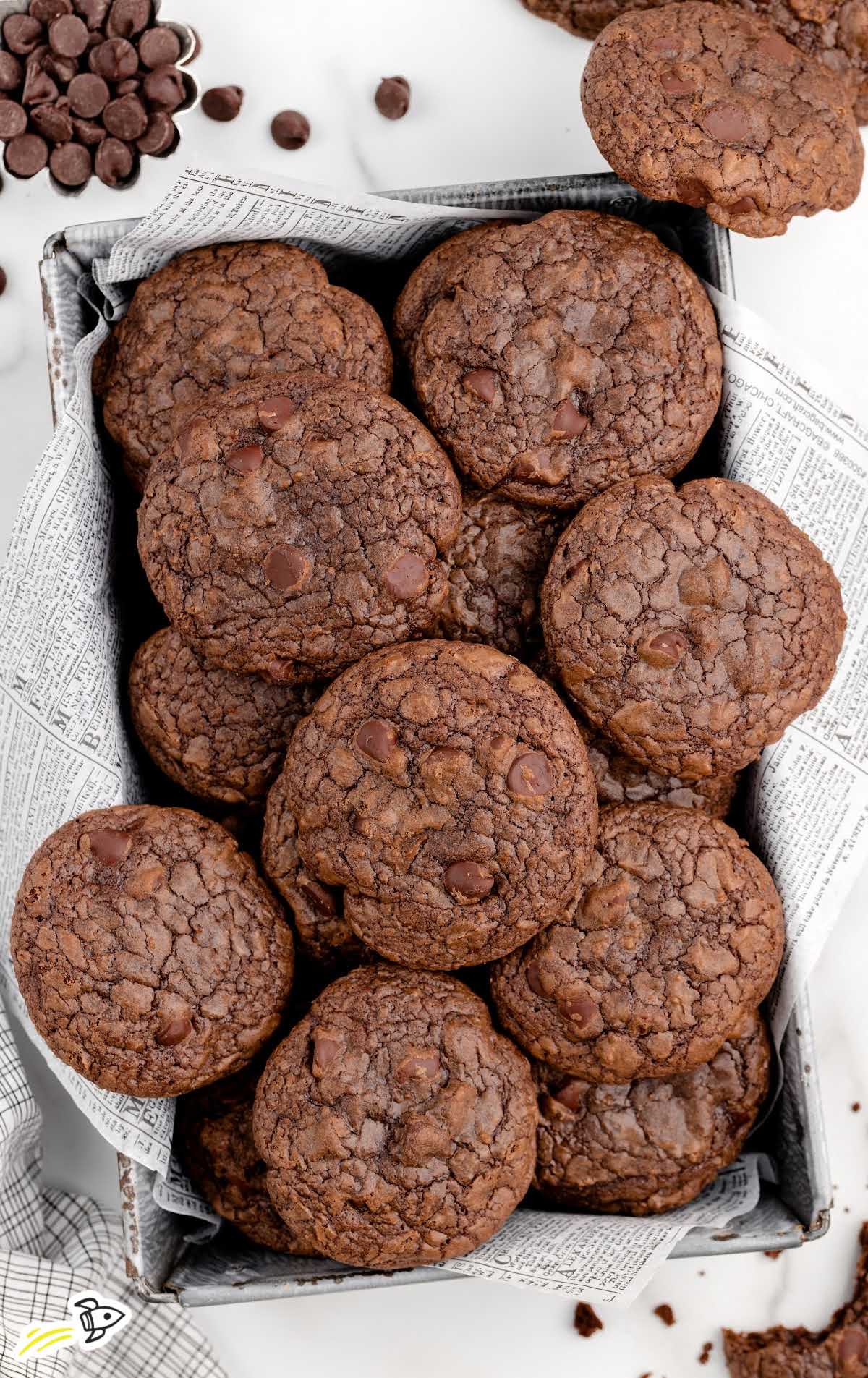 overhead shot of Brownie Mix Cookies piled on top of each other in a basket