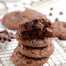 close up shot of Brownie Mix Cookies stacked on top of each other with one split in half